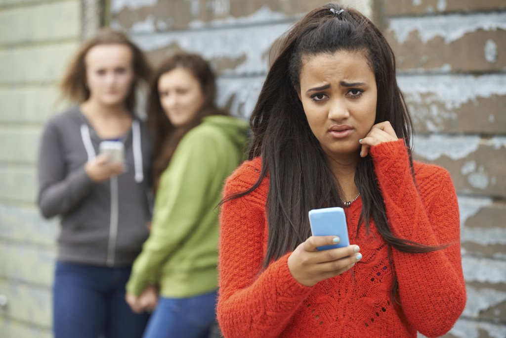 Teenage Girl Being Bullied By Text Message